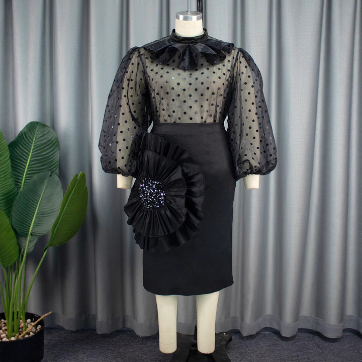 Damer Elegant klänning med transparenta puffärmar och rufsek accent Mirla-Eva Jonsson