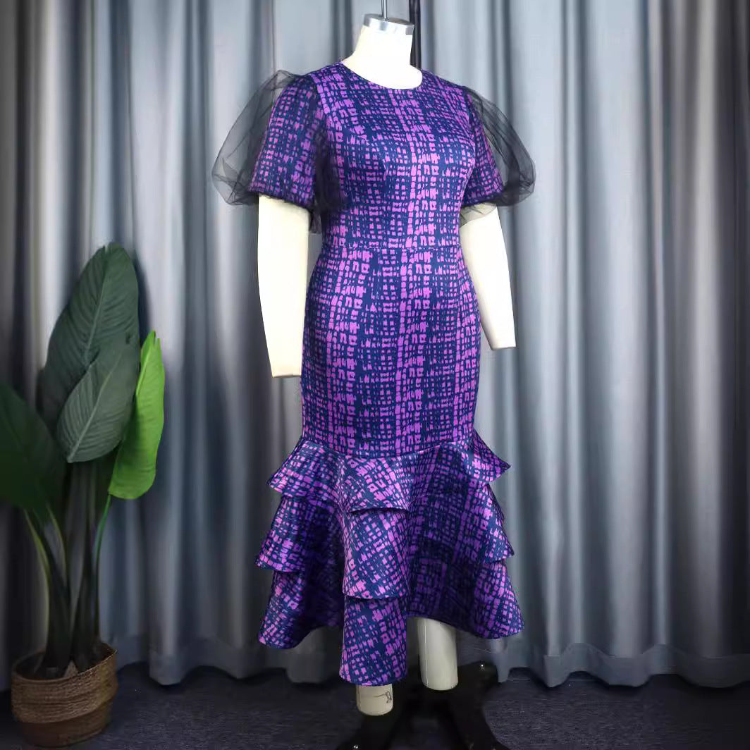 Damer Elegant klänning med voluminösa tyllärmar och asymmetrisk volangkjol Mirla-Eva Jonsson