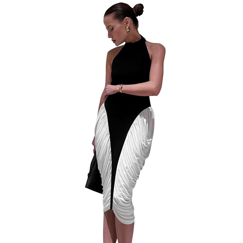 Damer Elegant kvällsklänning med djup ryggöppning och innovativ draperingsdesign Mirla-Eva Jonsson