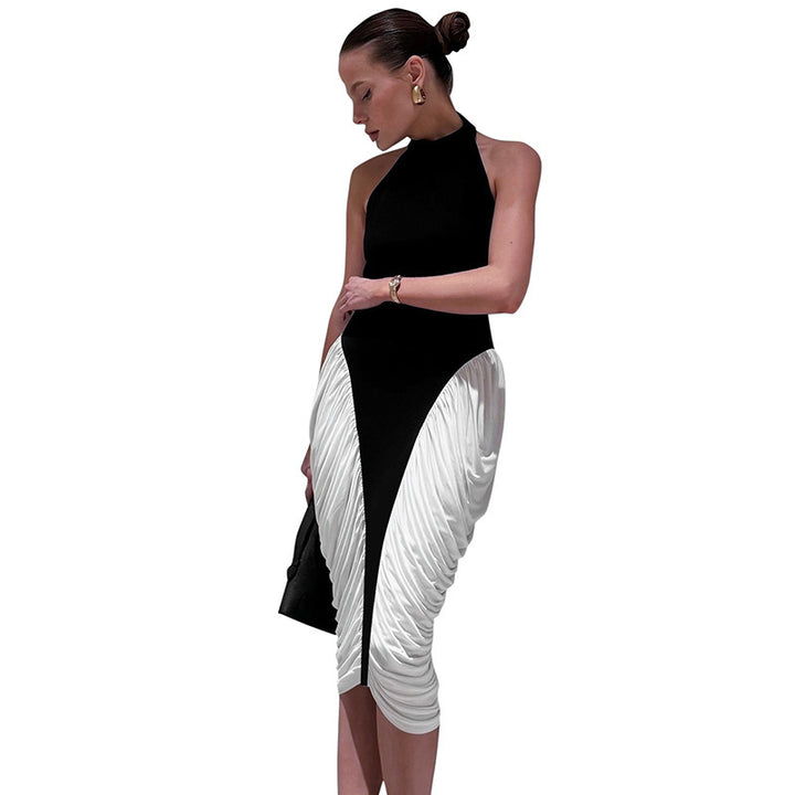 Damer Elegant kvällsklänning med djup ryggöppning och innovativ draperingsdesign Mirla-Eva Jonsson