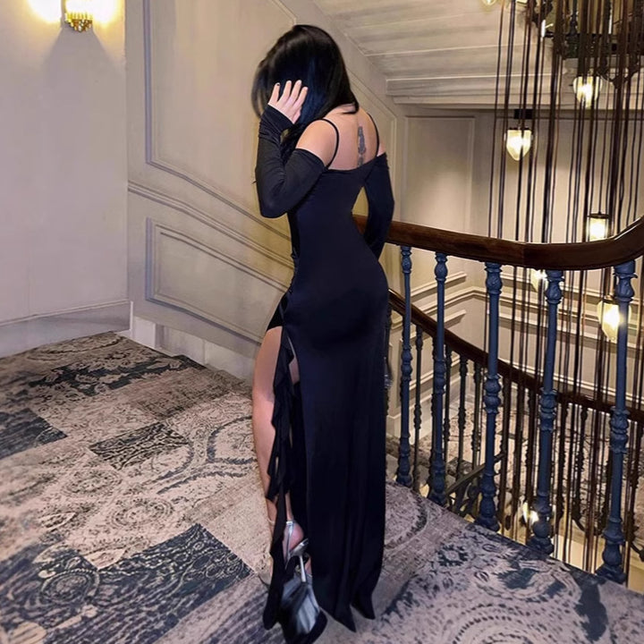 Damer Elegant långärmad maxiklänning med asymmetrisk fåll och volangdetaljer Mirla-Eva Jonsson