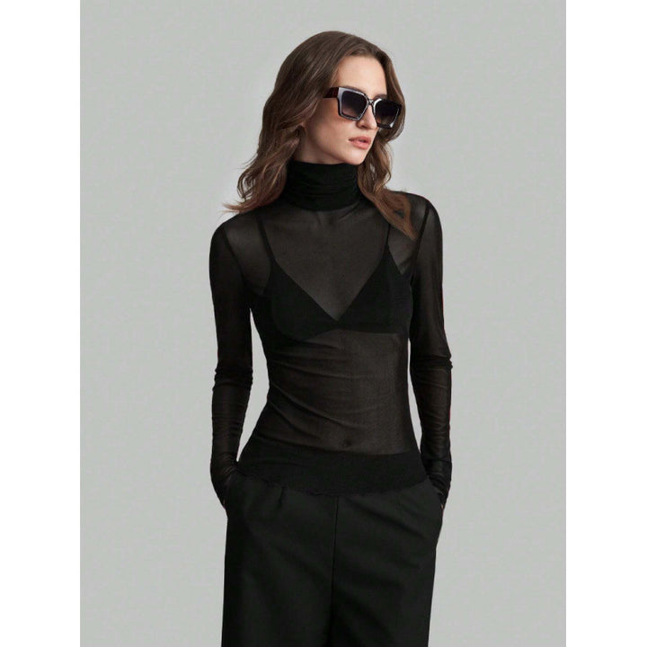 Damer Elegant långärmad transparent topp med hög krage Mirla-Eva Jonsson