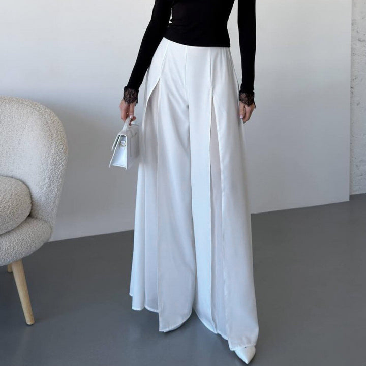Damer Elegant långbyxa med sidorslitsar och flödande snitt Mirla-Eva Jonsson