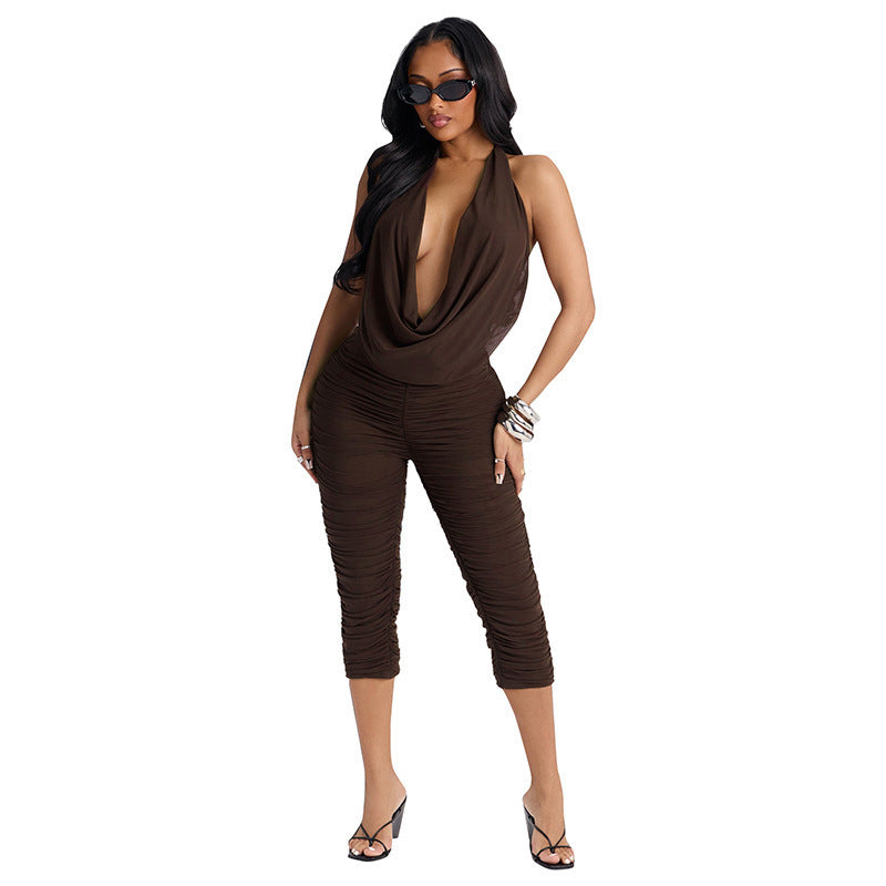 Damer Elegant och figurnära jumpsuit med djup V-ringning och rynkor Mirla-Eva Jonsson