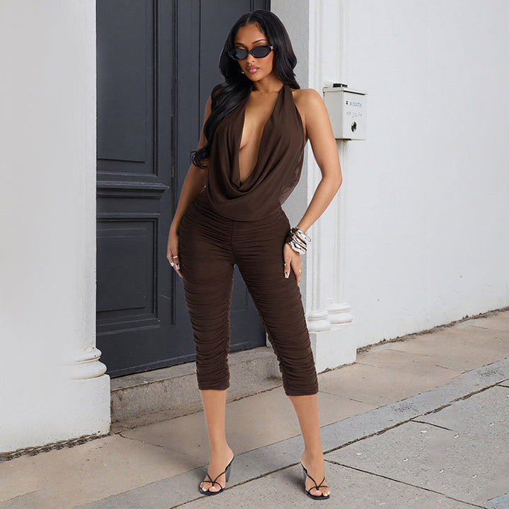 Damer Elegant och figurnära jumpsuit med djup V-ringning och rynkor Mirla-Eva Jonsson