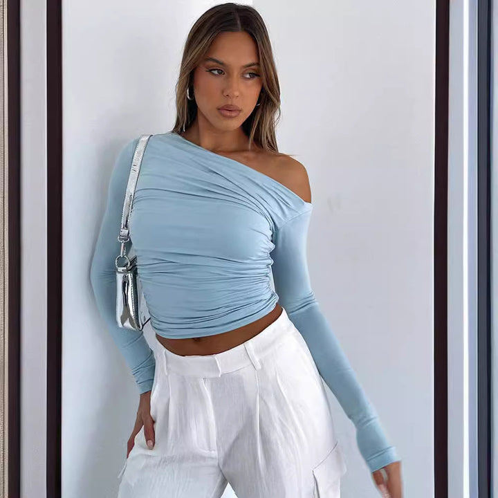 Damer Elegant och figursmickrande topp med asymmetrisk utskärning Mirla-Eva Jonsson