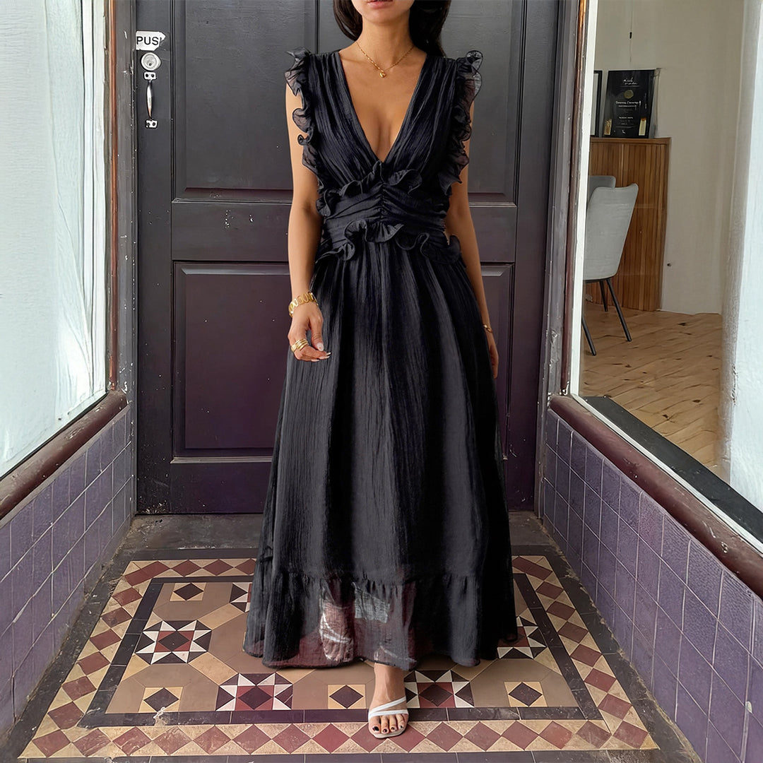 Damer Elegant omlottklänning med volangdetaljer och figurformad silhuett Mirla-Eva Jonsson