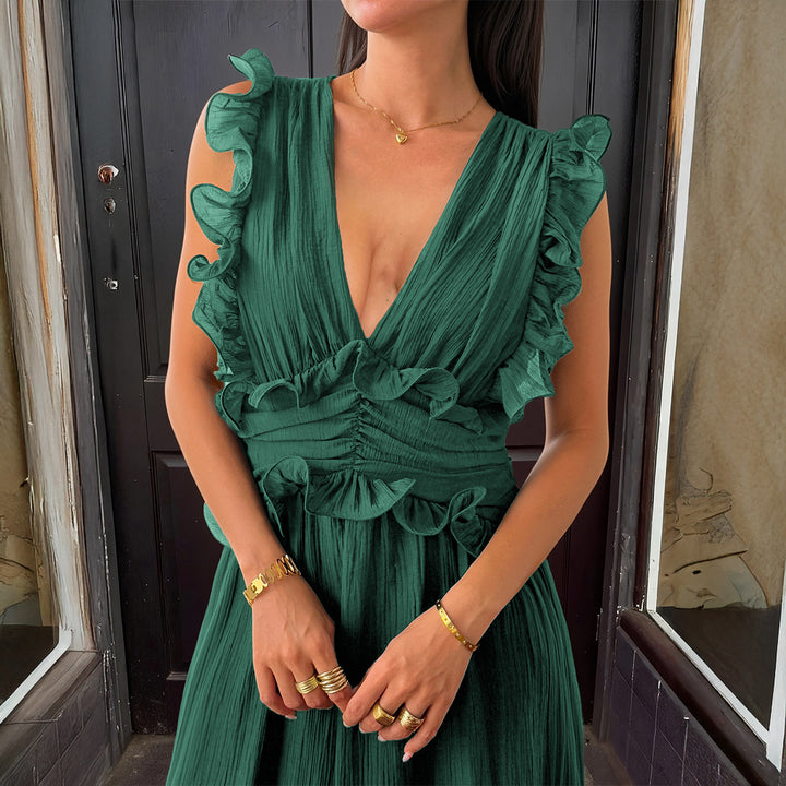 Damer Elegant omlottklänning med volangdetaljer och figurformad silhuett Mirla-Eva Jonsson