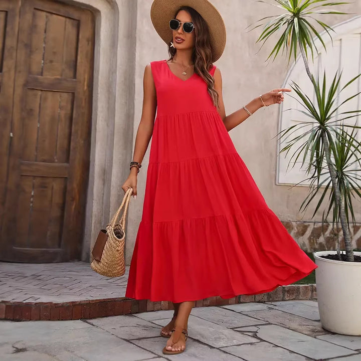 Damer Elegant sommar-maxiklänning med voluminös kjol och V-hals Mirla-Eva Jonsson