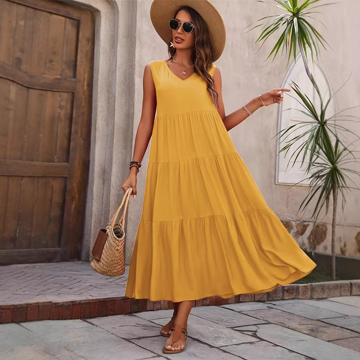 Damer Elegant sommar-maxiklänning med voluminös kjol och V-hals Mirla-Eva Jonsson