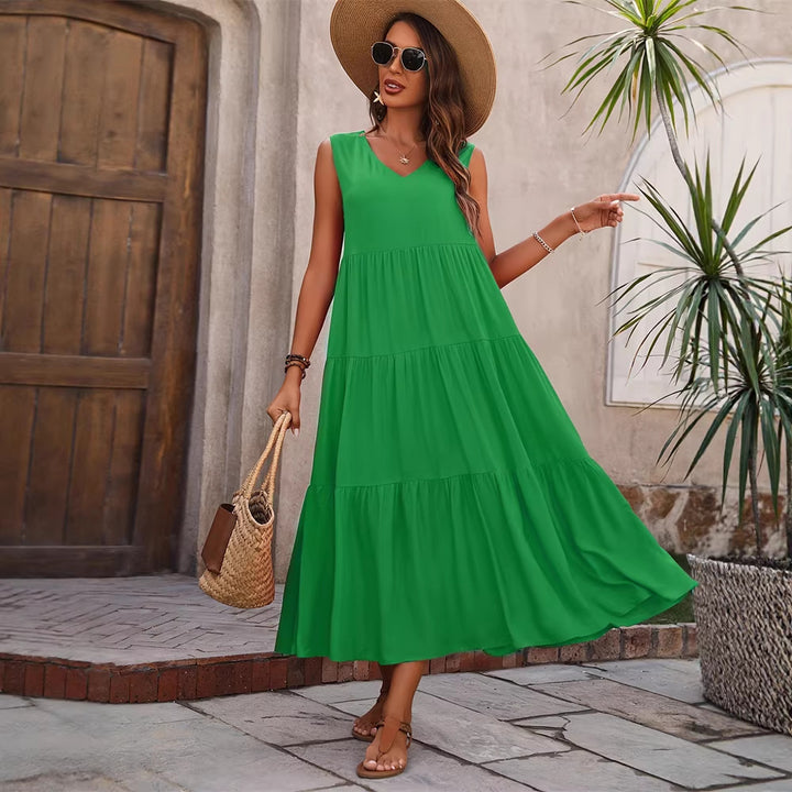 Damer Elegant sommar-maxiklänning med voluminös kjol och V-hals Mirla-Eva Jonsson