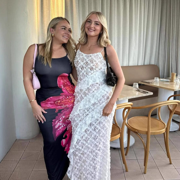 Damer Elegant spets maxiklänning med asymmetrisk drapering Mirla-Eva Jonsson