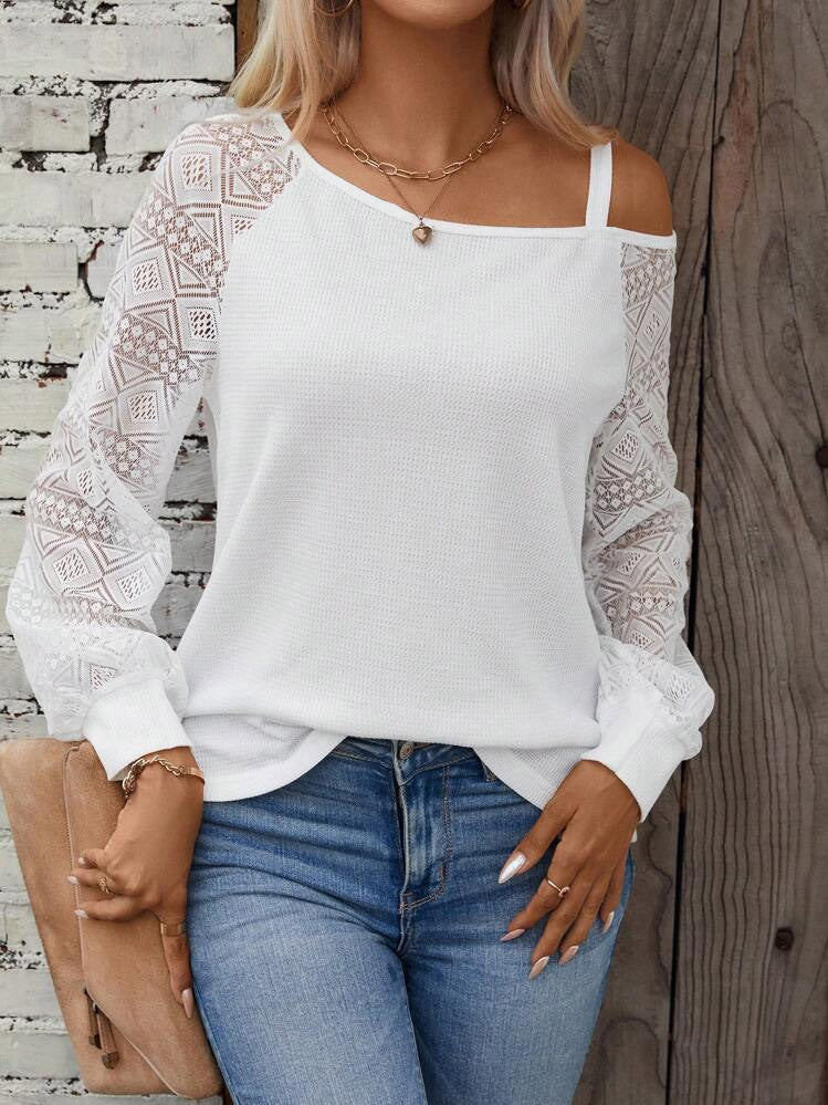 Damer Elegant stickad topp med asymmetrisk halsringning och dekorerade ärmar Mirla-Eva Jonsson