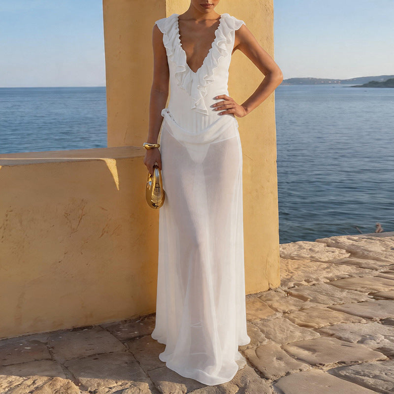 Damer Elegant strandklänning med fransiga detaljer och djup V-urringning Mirla-Eva Jonsson