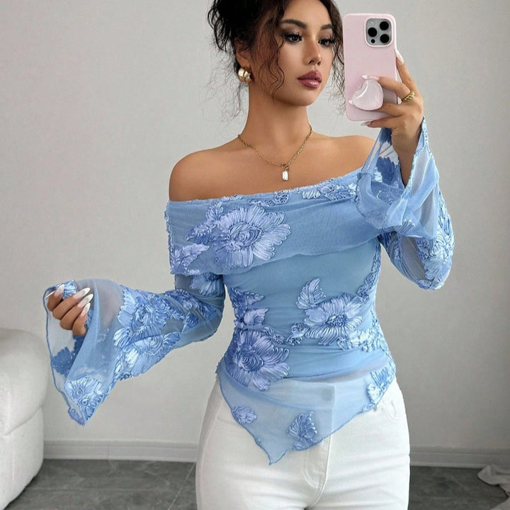 Damer Elegant topp med axelrörande design och blommönster Mirla-Eva Jonsson