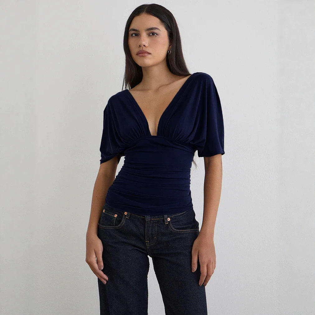 Damer Elegant topp med djup V-ringning och avslappnad draperingsdesign Mirla-Eva Jonsson