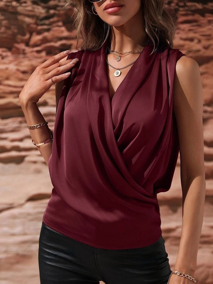 Damer Elegant topp med omslagsutseende och drapering Mirla-Eva Jonsson