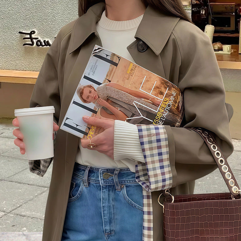 Damer Elegant trenchcoat med rutigt foder och vid passform Mirla-Eva Jonsson