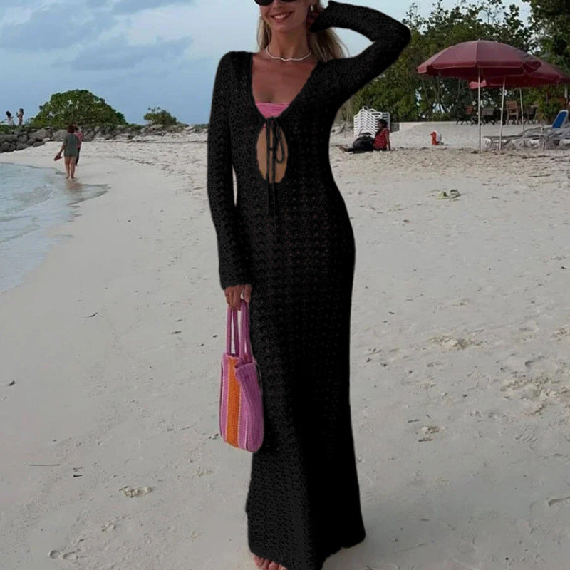 Damer Elegant virkade strandklänning med djup V-ringning och luftig struktur Mirla-Eva Jonsson