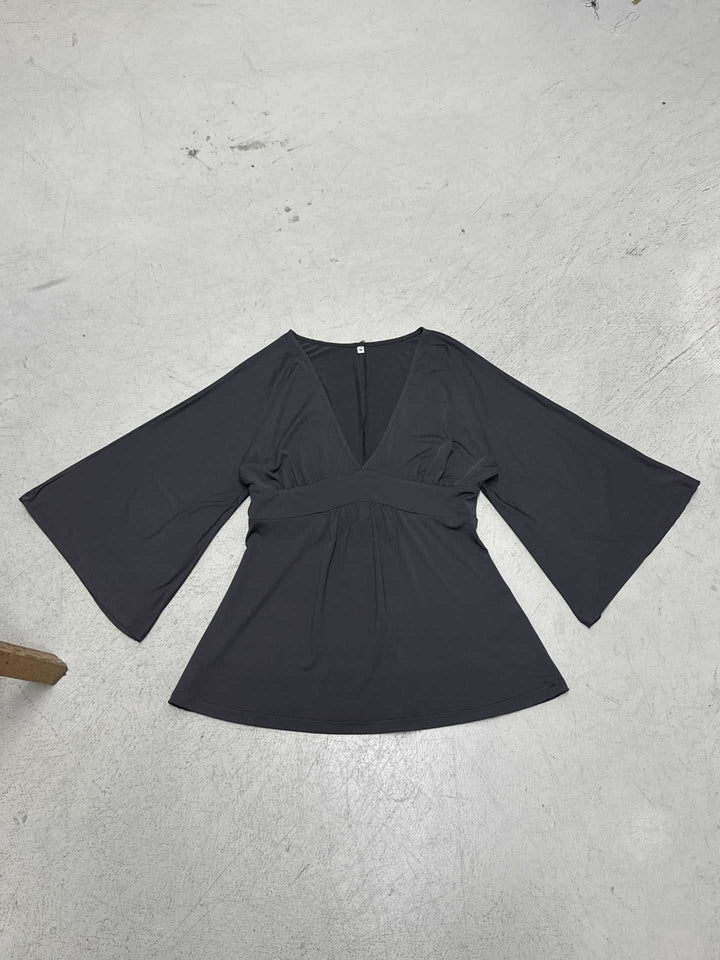 Damer Elegant wrap top med vida ärmar och V-ringning Mirla-Eva Jonsson
