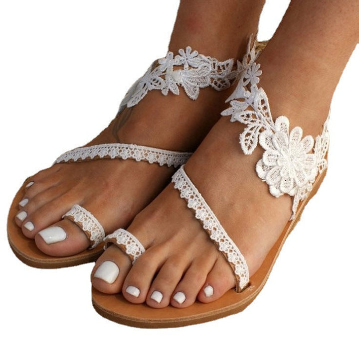 Damer Eleganta Sandaler med Blommiga Spetsdetaljer och Justerbara Remmar Mirla-Eva Jonsson