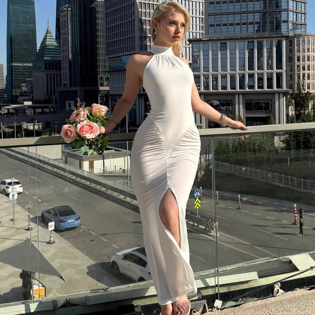 Damer Eleganta omslagklänning med hög slits och detaljälskad rynkad design Mirla-Eva Jonsson