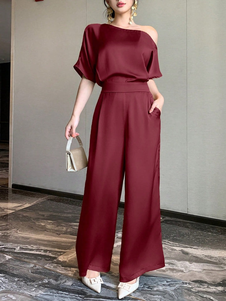 Damer En axel jumpsuit med vid ben och elegant snitt Mirla-Eva Jonsson