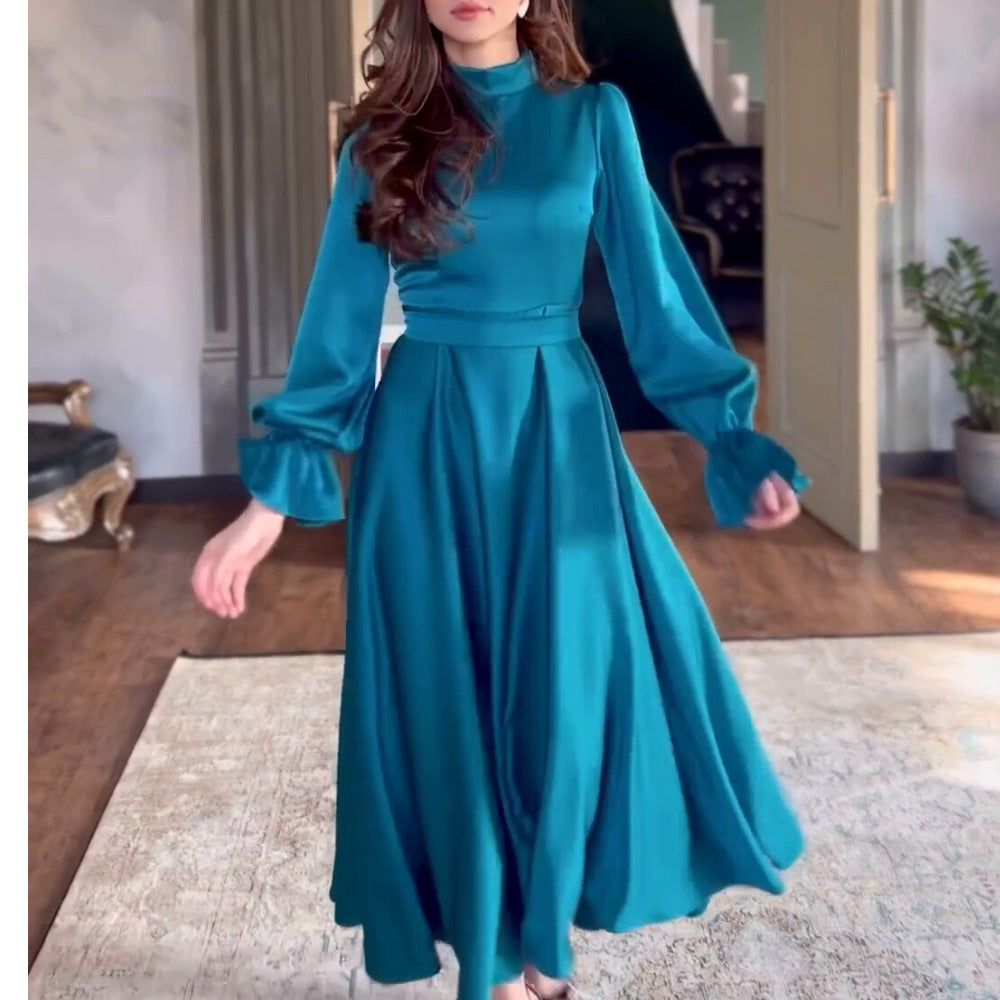 Damer Flödande Aftonklänning med eleganta Puffärmar och Hög Krage Mirla-Eva Jonsson