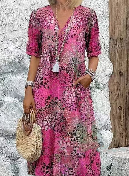 Damer Flödande sommardress med djup V-ringning och praktiska fickor Eva Jonsson-Eva Jonsson