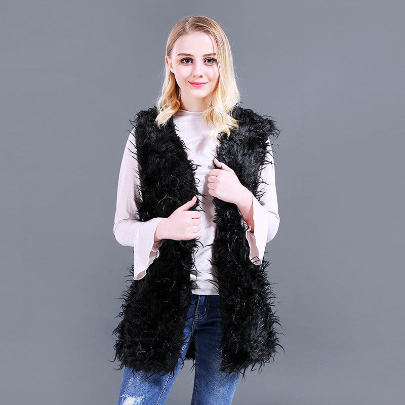 Damer Fuzzy Kaftan-väst av konstpäls med djup V-ringning och sidofickor Mirla-Eva Jonsson