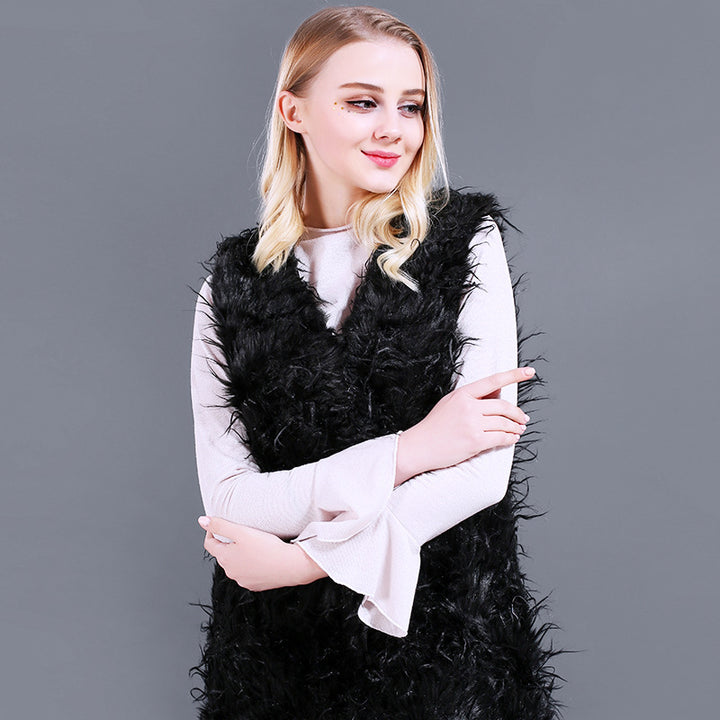 Damer Fuzzy Kaftan-väst av konstpäls med djup V-ringning och sidofickor Mirla-Eva Jonsson