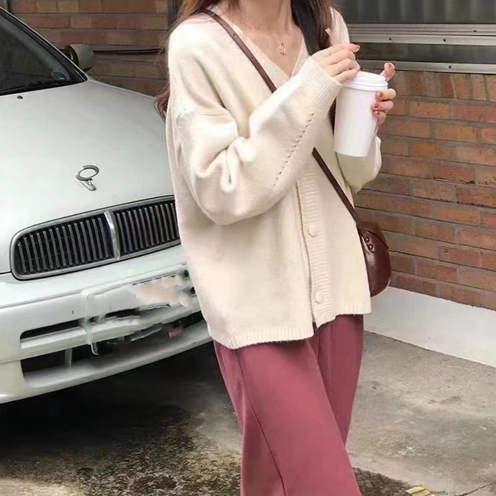 Damer Fuzzy Stickad cardigan med knapplist och lös passform Eva Jonsson-Eva Jonsson