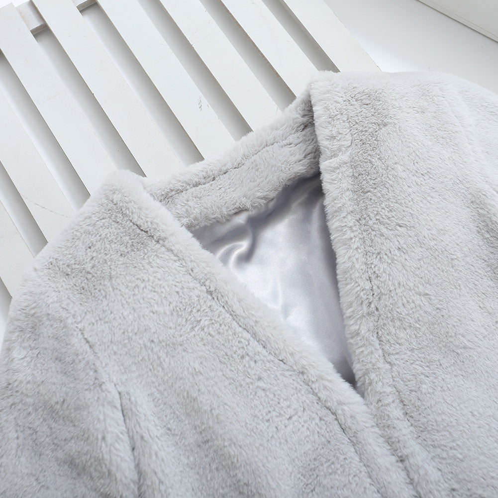 Damer Fuzzy konstfleece-kappa med elegant V-hals och praktiska fickor Mirla-Eva Jonsson