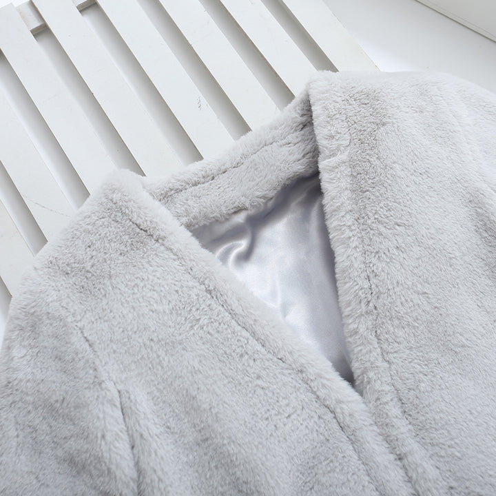 Damer Fuzzy konstfleece-kappa med elegant V-hals och praktiska fickor Mirla-Eva Jonsson