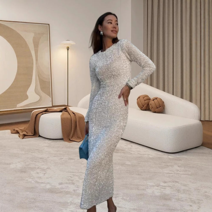 Damer Glamoröst Aftonklänning med glimmande paljetter och eleganta långa ärmar Mirla-Eva Jonsson