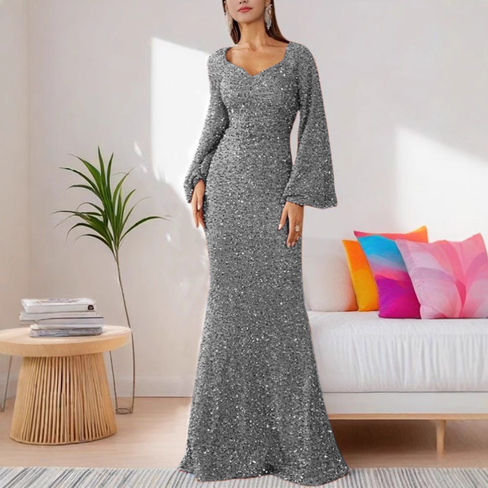 Damer Glamourös Glitter Kvällsklänning med Svängande Kjol och Voluminösa Ärmar Mirla-Eva Jonsson
