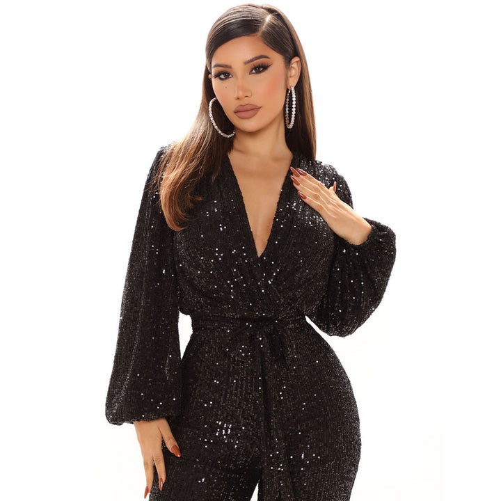 Damer Glittrande Jumpsuit med djup V-ringning och voluminösa ärmar Mirla-Eva Jonsson