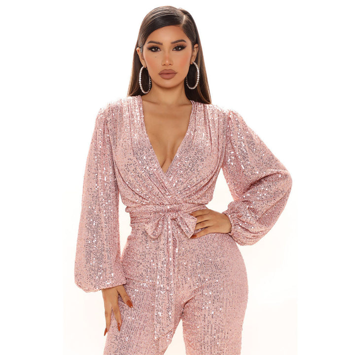 Damer Glittrande Jumpsuit med djup V-ringning och voluminösa ärmar Mirla-Eva Jonsson