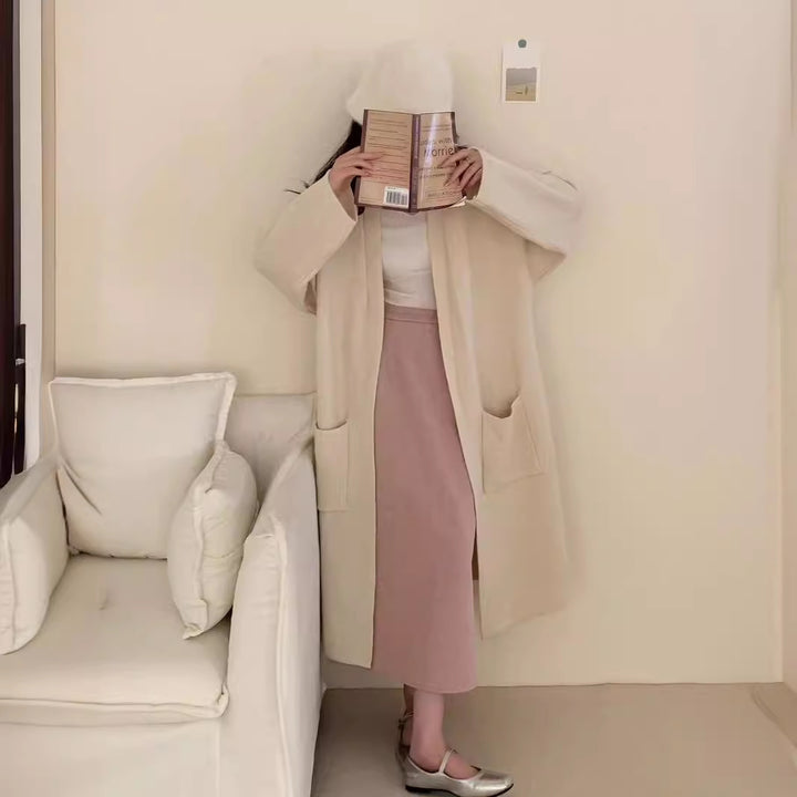 Damer Grovstickad Cardigan med avslappnade fickor och öppen design Mirla-Eva Jonsson