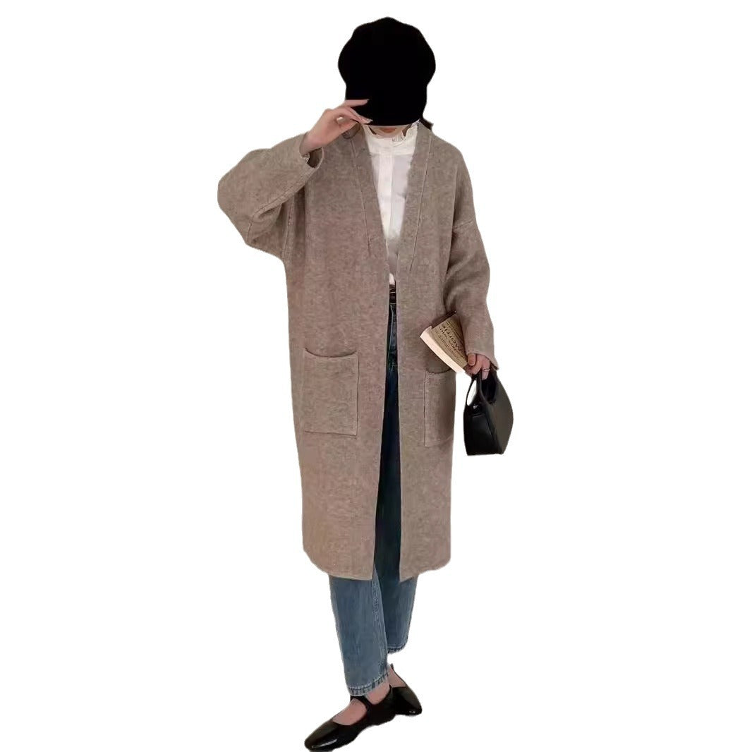 Damer Grovstickad Cardigan med avslappnade fickor och öppen design Mirla-Eva Jonsson