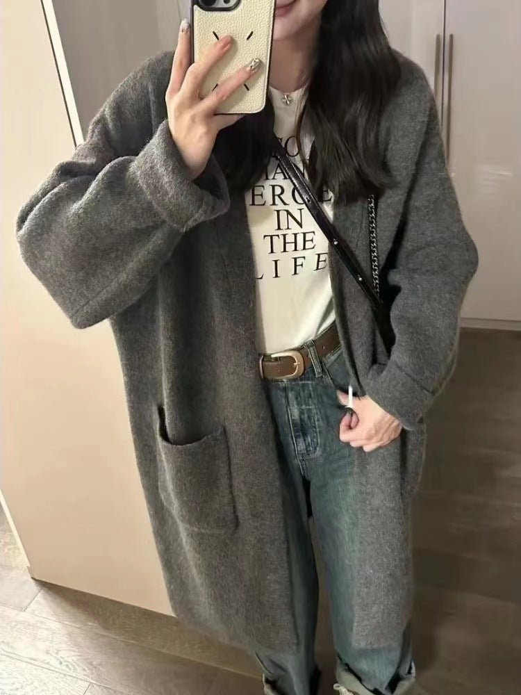 Damer Grovstickad Cardigan med avslappnade fickor och öppen design Mirla-Eva Jonsson