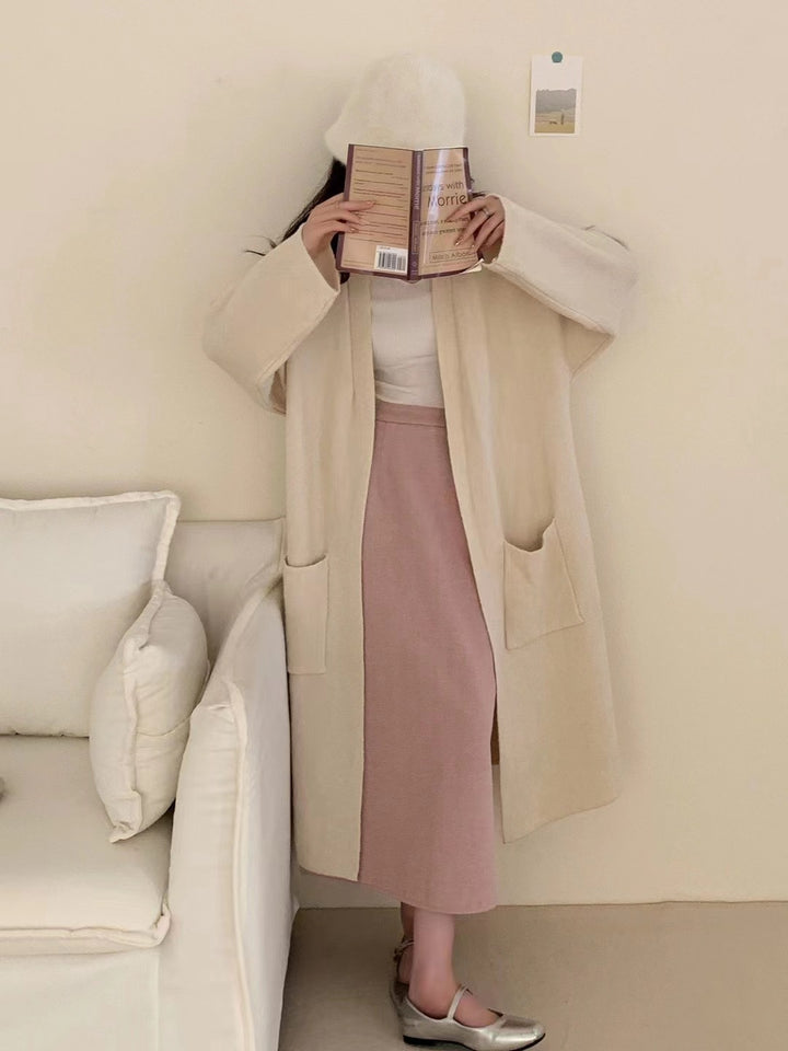 Damer Grovstickad Cardigan med avslappnade fickor och öppen design Mirla-Eva Jonsson