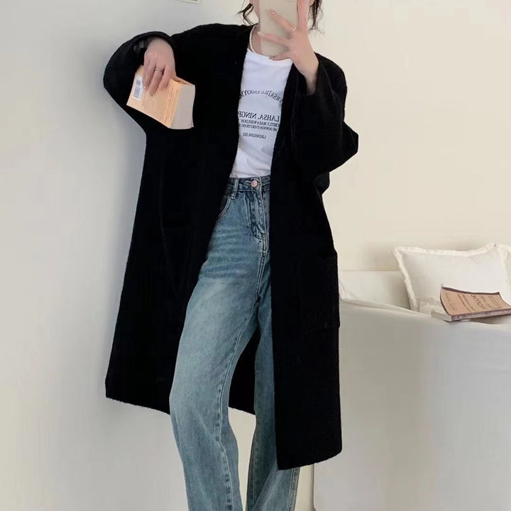 Damer Grovstickad Cardigan med avslappnade fickor och öppen design Mirla-Eva Jonsson