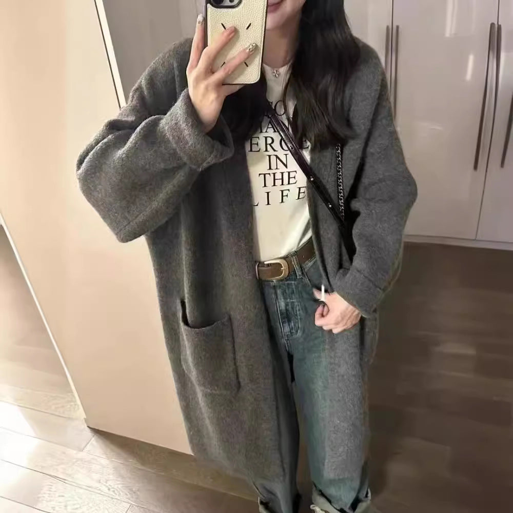 Damer Grovstickad Cardigan med avslappnade fickor och öppen design Mirla-Eva Jonsson