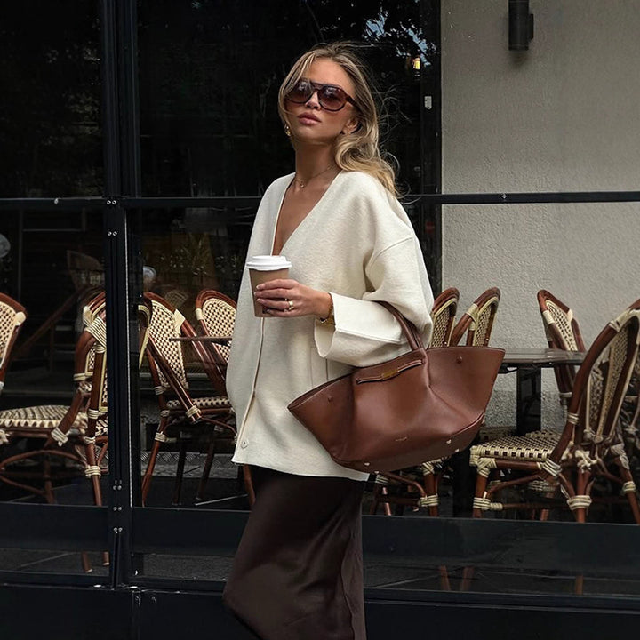 Damer Grovstickjacka med djup V-urringning och vida ärmar Eva Jonsson-Eva Jonsson
