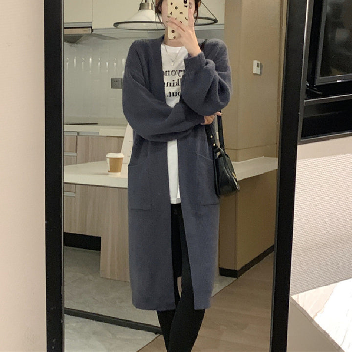 Damer Lång Stickad Cardigan med Praktiska Fickor och Elegant Silhuett Mirla-Eva Jonsson