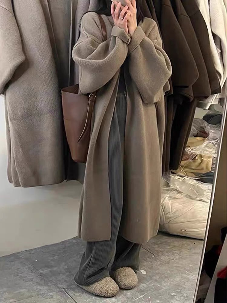 Damer Lång Ullrock i minimalistisk stil med bred passform och eleganta detaljer Eva Jonsson-Eva Jonsson