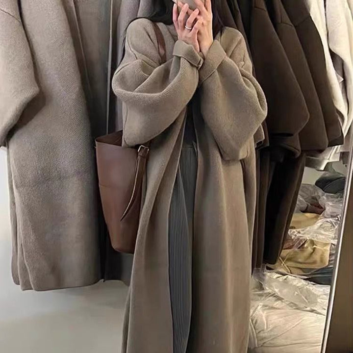 Damer Lång Ullrock i minimalistisk stil med bred passform och eleganta detaljer Eva Jonsson-Eva Jonsson
