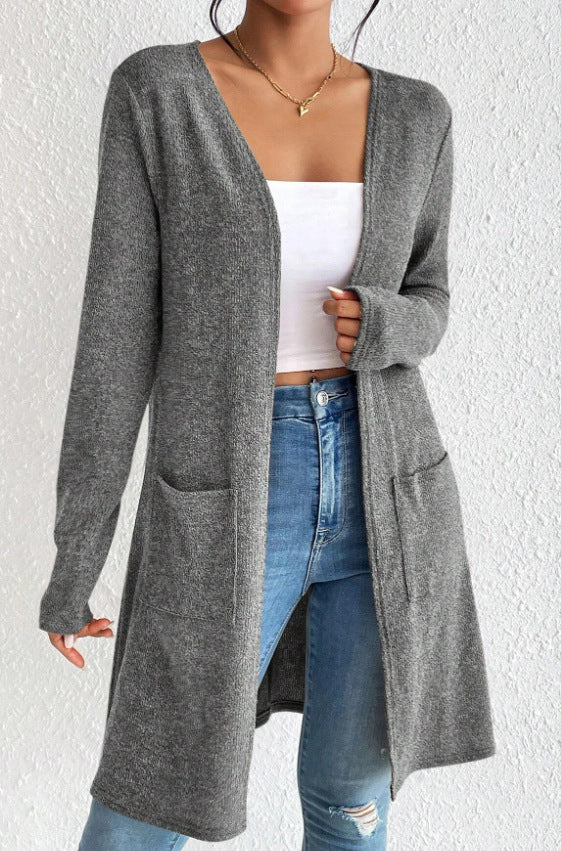 Damer Lång stickad cardigan med praktiska fickor Mirla-Eva Jonsson