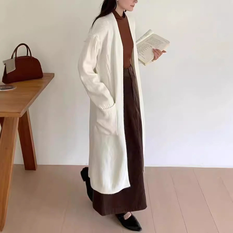 Damer Lång stickad cardigan med praktiska fickor och avslappnad passform Mirla-Eva Jonsson